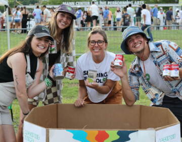 Sharing Excess accepted food donations outside of The Mann Center on Aug. 12 and 13 ahead of Mt. Joy's two-night stint at the venue. (Credit Cory Sharber/WHYY)