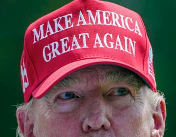 Trump wearing a MAGA hat