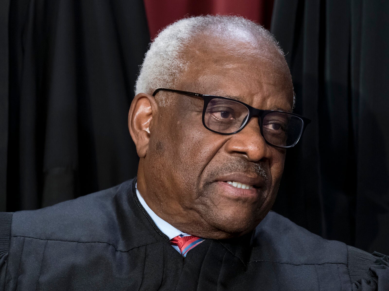 Associate Justice Clarence Thomas joins other members of the Supreme Court as they pose for a group portrait on Oct. 7, 2022