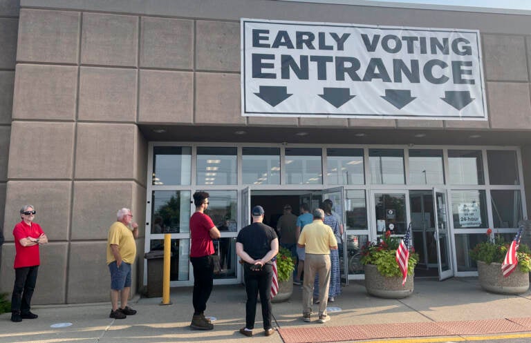 Ohio residents line up to vote early in-person on Issue 1 in front of the Franklin County Board of Elections in Columbus, Ohio, on Thursday. Samantha Hendrickson/AP