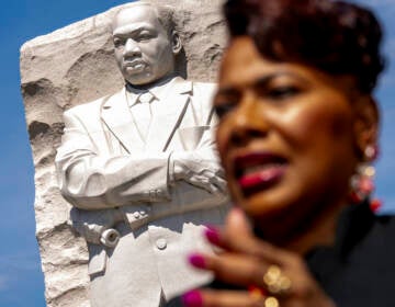 A close-up of Bernice King. A memorial to her father, Martin Luther King Jr., is visible in the background.