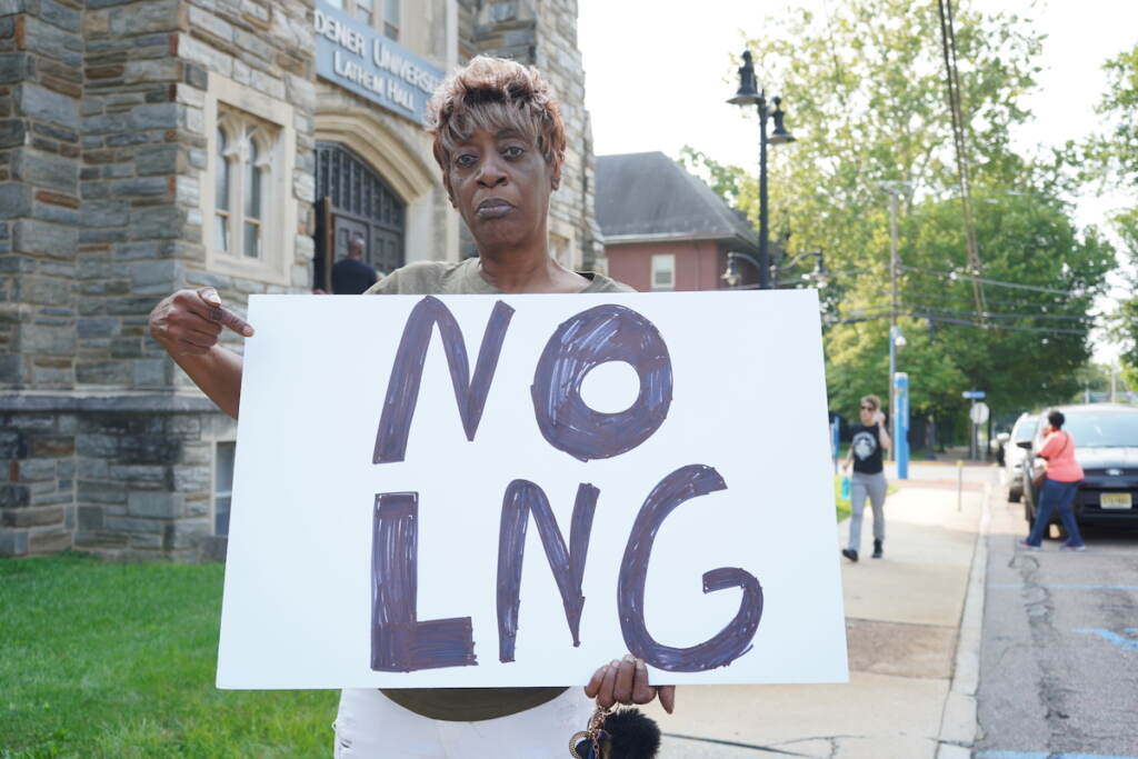 Carla Stevenson holds a sign that reads NO LNG