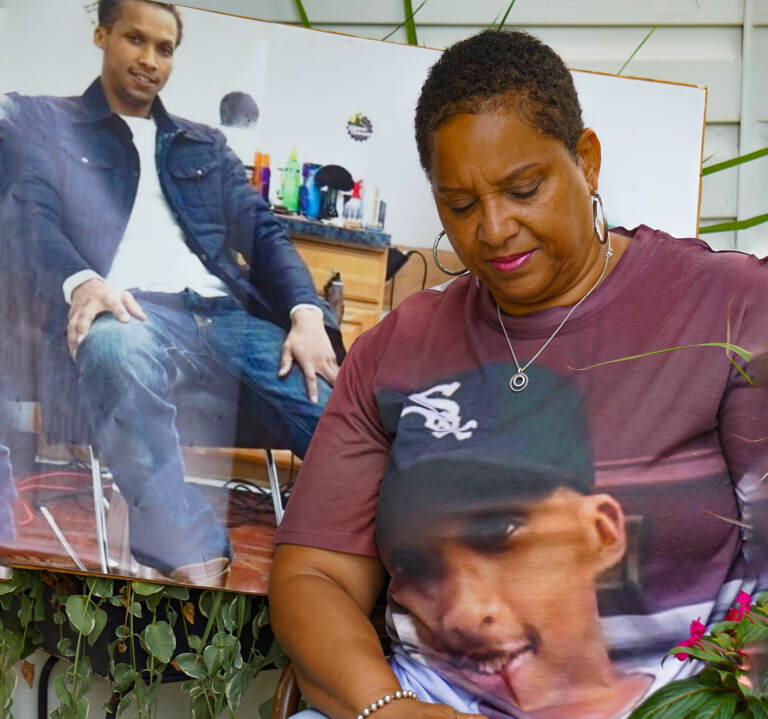 Crystal Arthur with photos of her son Kristian