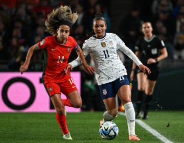 USA forward Sophia Smith (R) fights for the ball with Portugal midfielder Dolores Silva during the 2023 Women's World Cup match in Auckland, New Zealand on August 1, 2023.