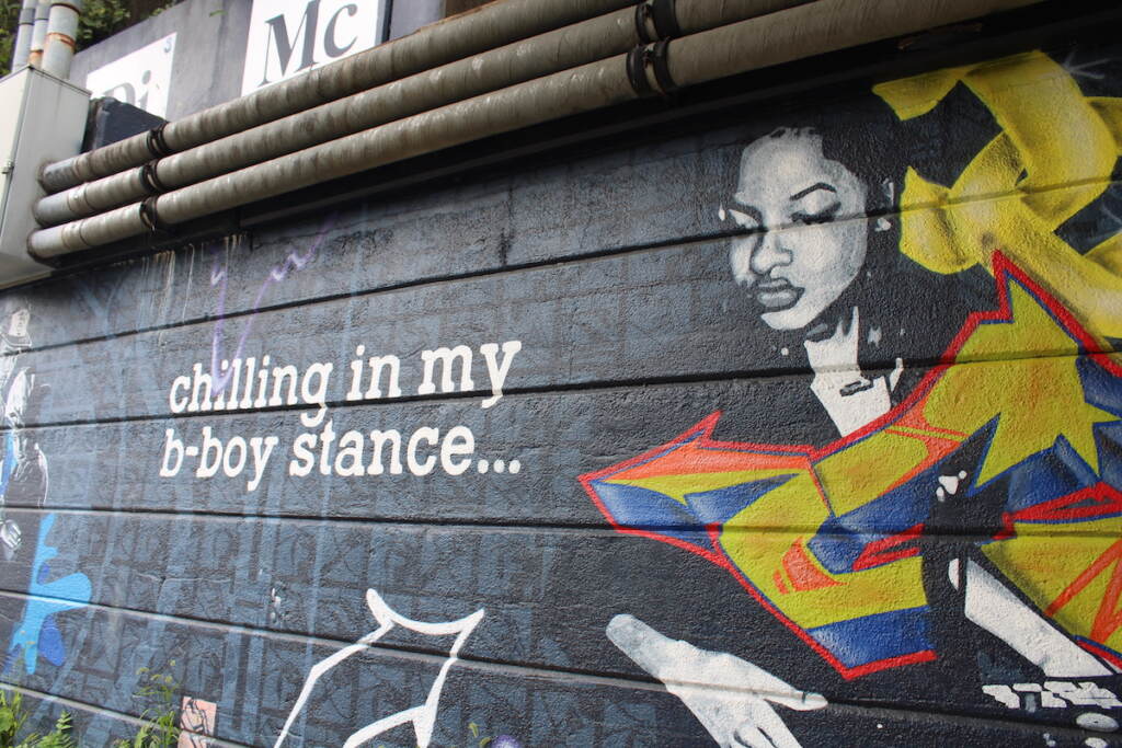 Text reads "chilling in my b-boy stance" next to a painting of a DJ.