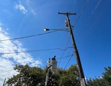 A contractor installs an LED street light