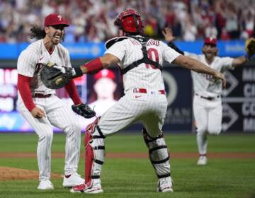 Philadelphia Phillies pitcher Michael Lorenzen, left, and J.T. Realmuto celebrate after Lorenzen's no-hitter during a baseball game against the Washington Nationals, Wednesday, Aug. 9, 2023, in Philadelphia