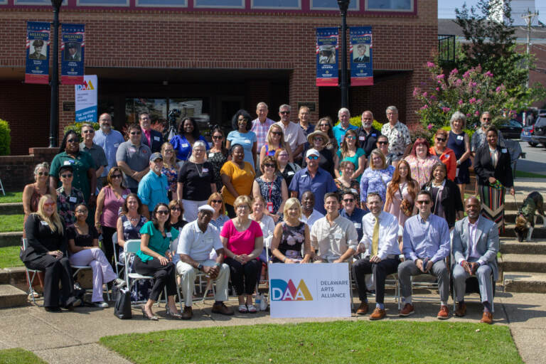 A group photo of Delaware leaders and artists