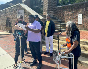Writer and activist Abdul-Aliy A. Muhammad speaks at a press conference in front of Penn Museum on Thursday. Also present are City Council at-large candidate Nicolas O'Rourke, Mike Africa Jr., and Ramona Africa
