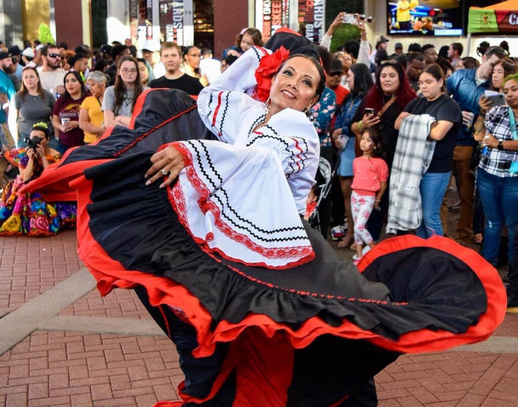 A woman dancing at a festival