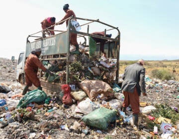 Trash collectors from Marsabit Safi Services offload waste at the Dadach Boshe dump. Even though Kenyan banned single-use plastic bags in 2016, they're still piling up at the dump and blowing off to litter the landscape and bodies of water.