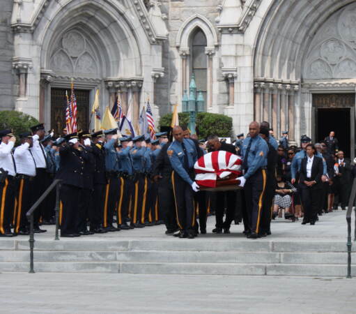 Pallbearers carrying the casket of N.J. Lt. Gov. Sheila Oliver out of the Cathedral Basilica of the Sacred Heart in Newark, N.J. after her memorial service. (P. Kenneth Burns/WHYY)