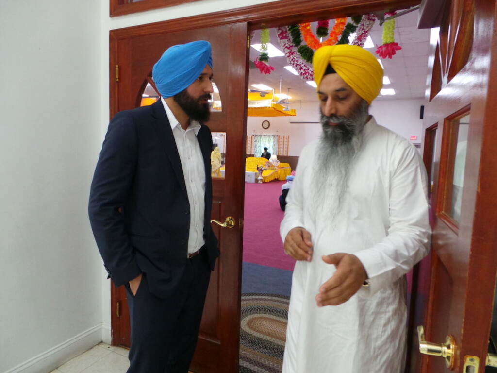 Bhupindar Singh (left) talks with Head Priest Giani Gurjit Singh