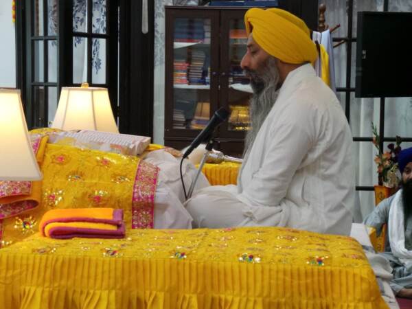 Head Priest Giani Gurjit Singh reciting hymns