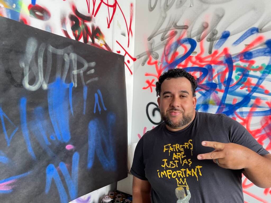 Christian "TAMEARTZ" Rodriguez poses for a photo in his studio.