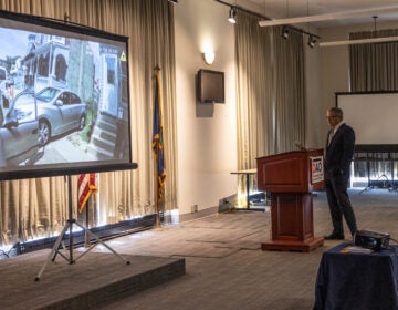 Philadelphia District Attorney Larry Krasner watches the body camera footage of former officer Mark Dial’s partner at a press conference announcing murder and other charges against Dial in the shooting and killing of 27-year-old Eddie Irizarry on September 8, 2023. (Kimberly Paynter/WHYY)