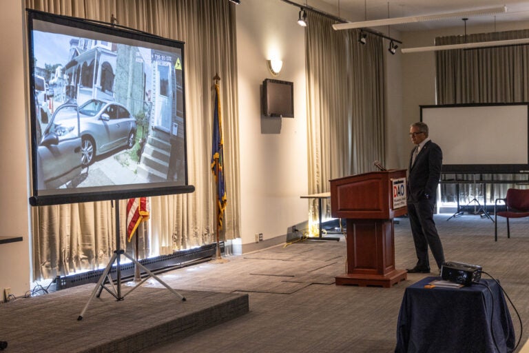 Philadelphia District Attorney Larry Krasner watches the body camera footage of former officer Mark Dial’s partner at a press conference announcing murder and other charges against Dial in the shooting and killing of 27-year-old Eddie Irizarry on September 8, 2023. (Kimberly Paynter/WHYY)