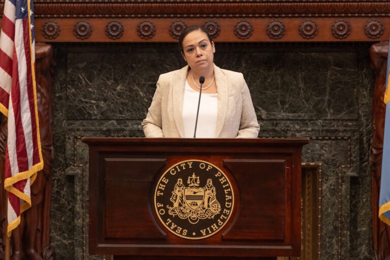 Philadelphia City Solicitor Diana Cortes speaks at a podium.