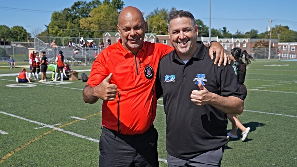 Philadelphia Parks & Rec Deputy Commissioner of Programs Bill Salvatore (left) poses with one of the match officials