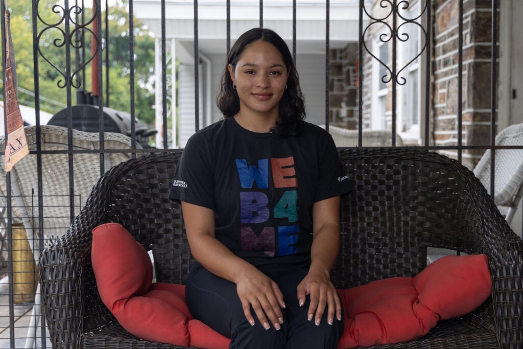 Nilda Diaz posing for a photo on her front porch