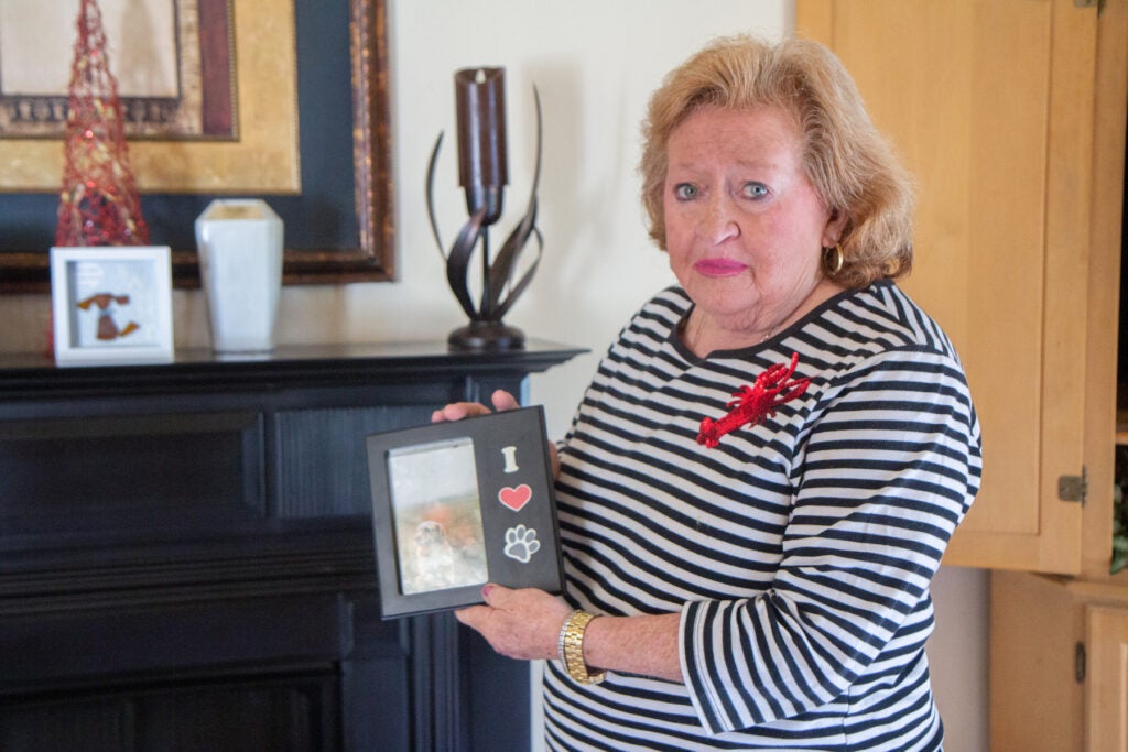 Diane Longo shows a photo of her dog that passed away.