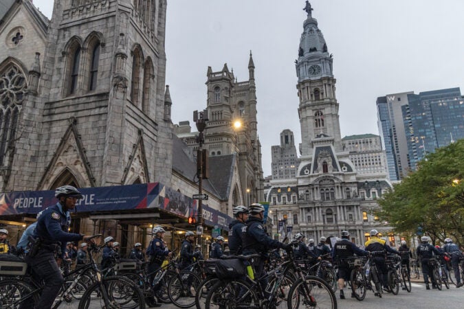 Rows of Philadelphia police officers on bikes oustide of City Hall.