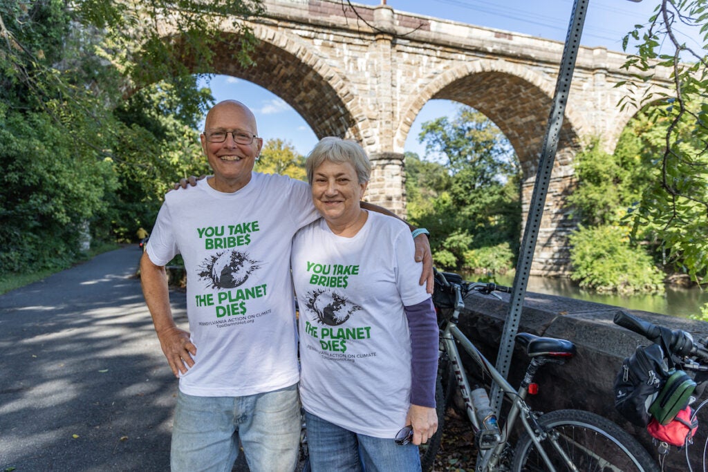 Ted Uhlman (left) and Marci Henzi (right) pose for a photo together on the Schuylkill River Trail