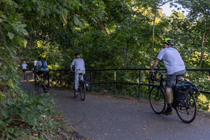 The climate bike team rides through the Schuylkill River Trail