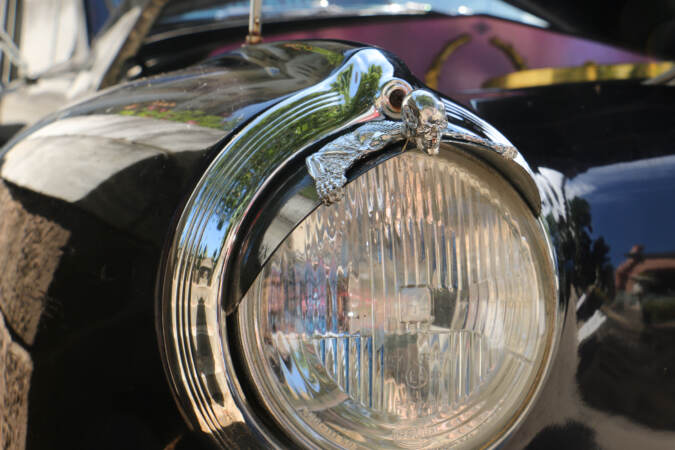 A close up of headlight visors with a skeleton creature