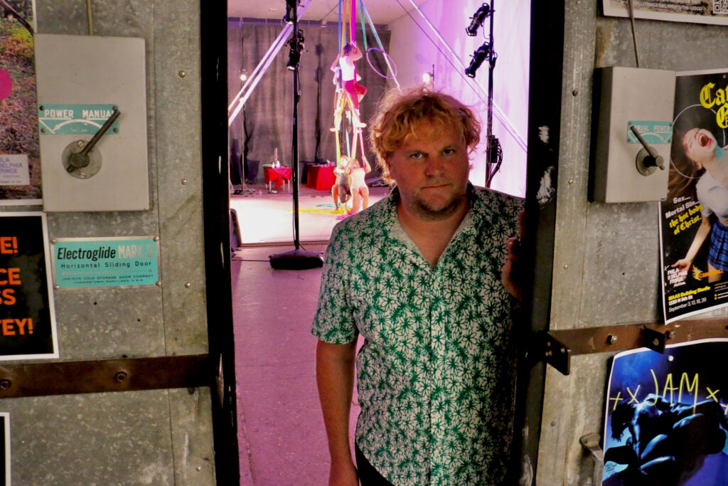 Tim Belknap poses in a doorway