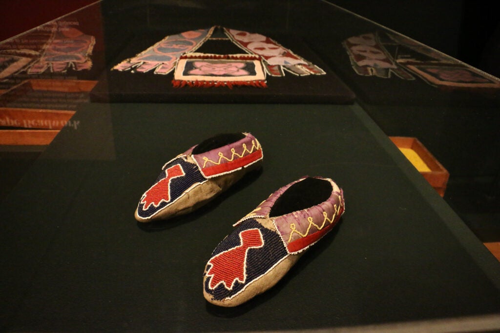 Beaded moccasins and a bandolier bag from the 19th century show how Lenape designers incorporated new materials and techniques from other cultures into their work