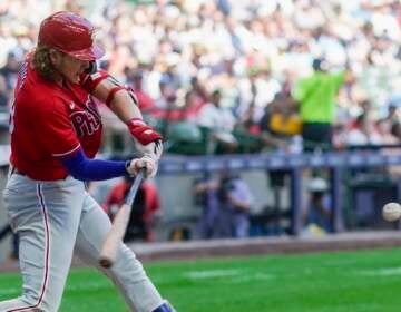 Phillies' Bryce Harper Signs His Helmet for a Young Fan After Being Ejected