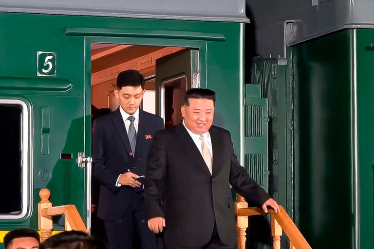 In this photo taken from video released by governor of the Russian far eastern region of Primorsky Krai Oleg Kozhemyako telegram channel on Tuesday, Sept. 12, 2023, North Korea's leader Kim Jong Un (foreground) steps down from his train after crossing the border to Russia at Khasan, about 127 km (79 miles) south of Vladivostok. North Korea's Kim Jong Un rolled into Russia on an armored train to see President Vladimir Putin