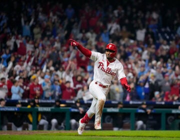 Philadelphia Phillies' Johan Rojas celebrates after hitting a game-winning run-scoring single in the 10th inning of a baseball game against the Pittsburgh Pirates to clinch a wild-card playoff spot, Tuesday, Sept. 26, 2023, in Philadelphia