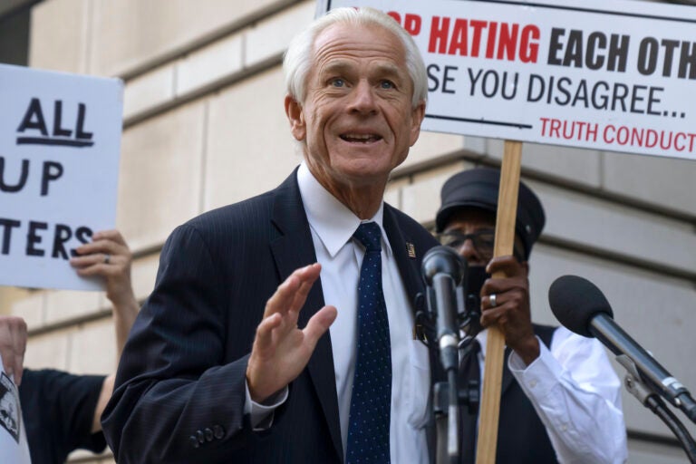 Peter Navarro speaking into a microphone