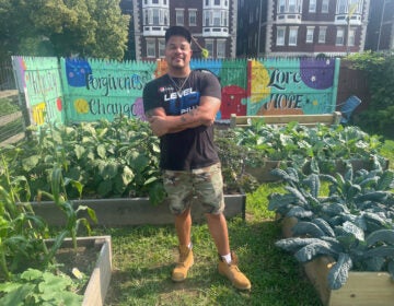  Aaron Campbell, pastor of Antioch Christian Fellowship Church and founder of Level Up, standing in the program’s garden. Photo by Cherri Gregg