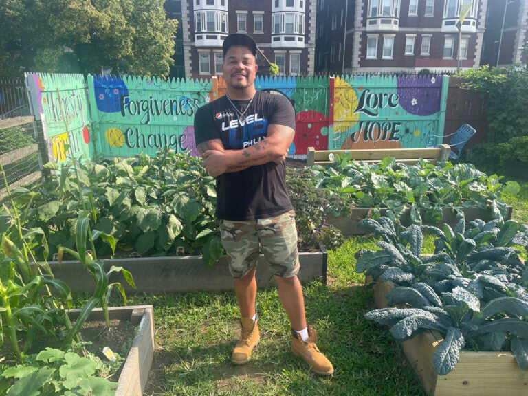  Aaron Campbell, pastor of Antioch Christian Fellowship Church and founder of Level Up, standing in the program’s garden. Photo by Cherri Gregg