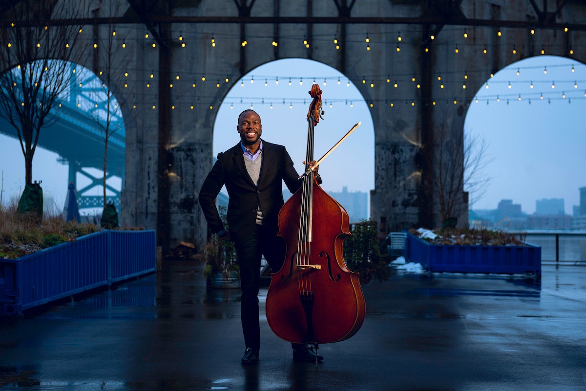 Joseph Conyers poses with a bass at Cherry Street Pier