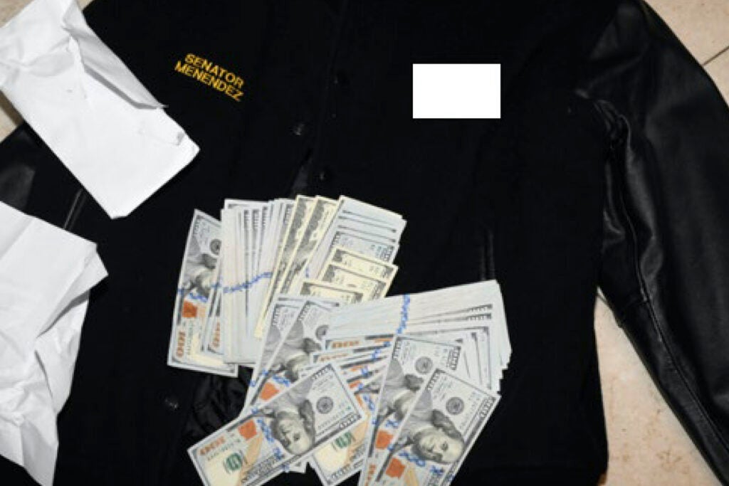 A jacket bearing Menendez's name, along with cash from envelops found inside the Jacket during a search by federal agents of the senator's home in Harrison