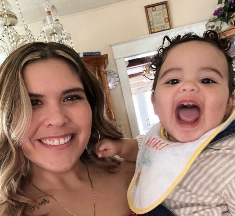 Victoria Rodriguez poses for a photo with her son, Silas.