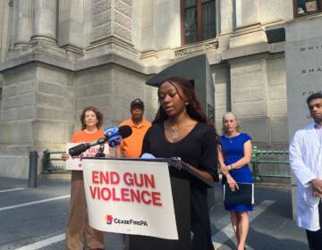 Anya Coleman-Hill speaks at a podium.