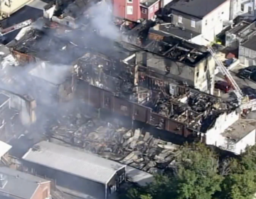 Damage is seen via helicopter after a four-alarm fire tore through multiple buildings in Oxford, Chester County.