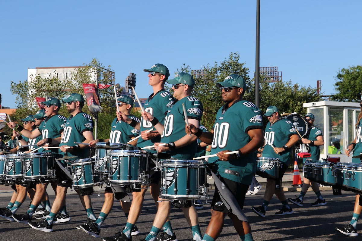 The Eagles Drumline marches outside the stadium