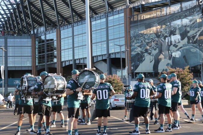 The Eagles Drumline marches outside the stadium