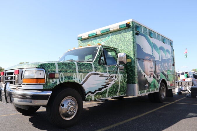 A truck decorated with the Eagles logo and photos of players.