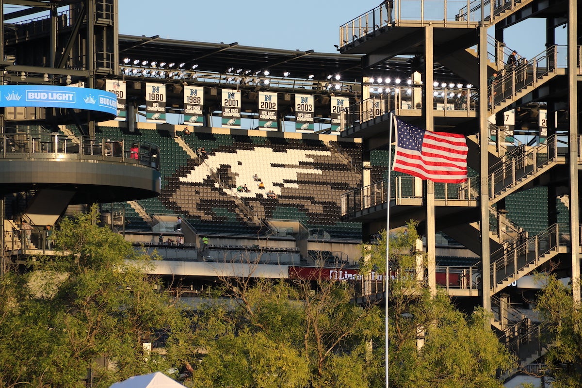 Eagles fans sitting in a mostly empty stadium hours before game time.