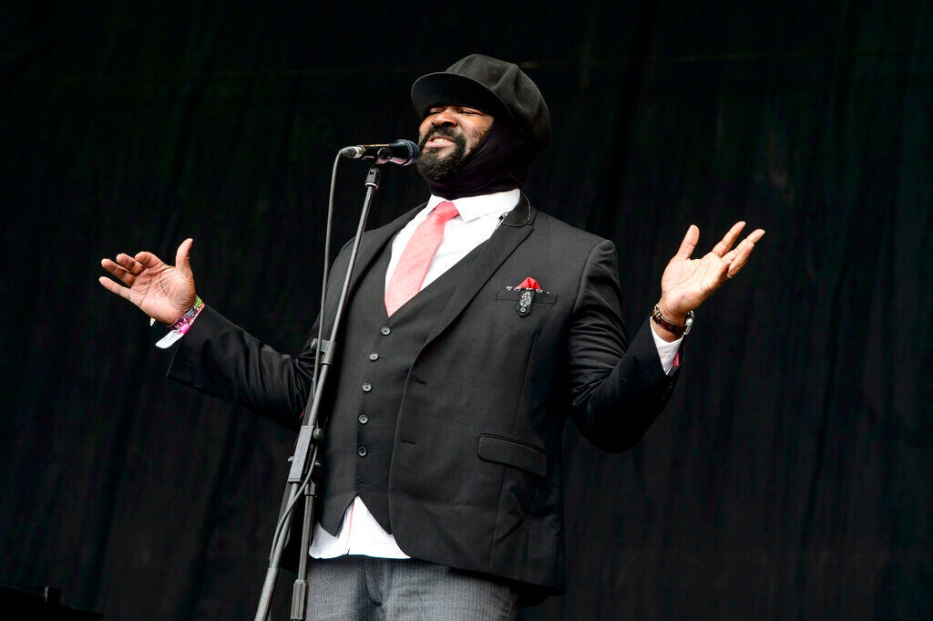 Gregory Porter singing at a microphone