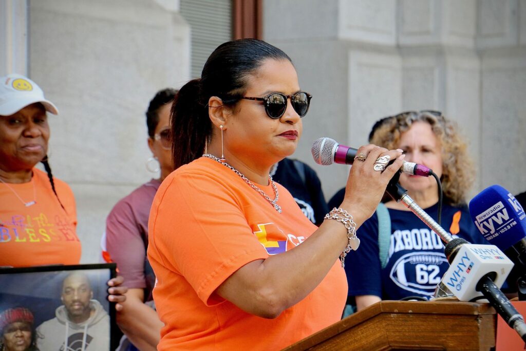 Roz Pichardo speaking at a podium