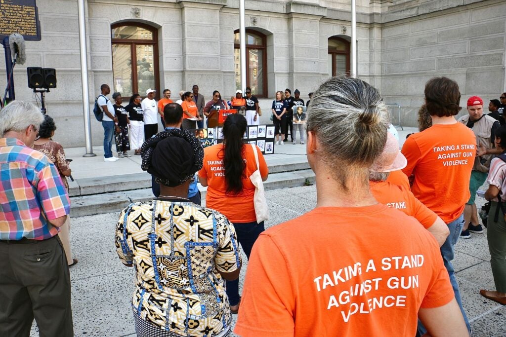 People listening to the speakers at the rally