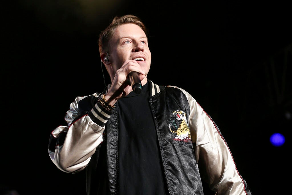 Macklemore performs onstage.